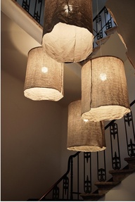 We love linen in any form. Here lanterns get dressed in nubbly linen. Love, love, love.