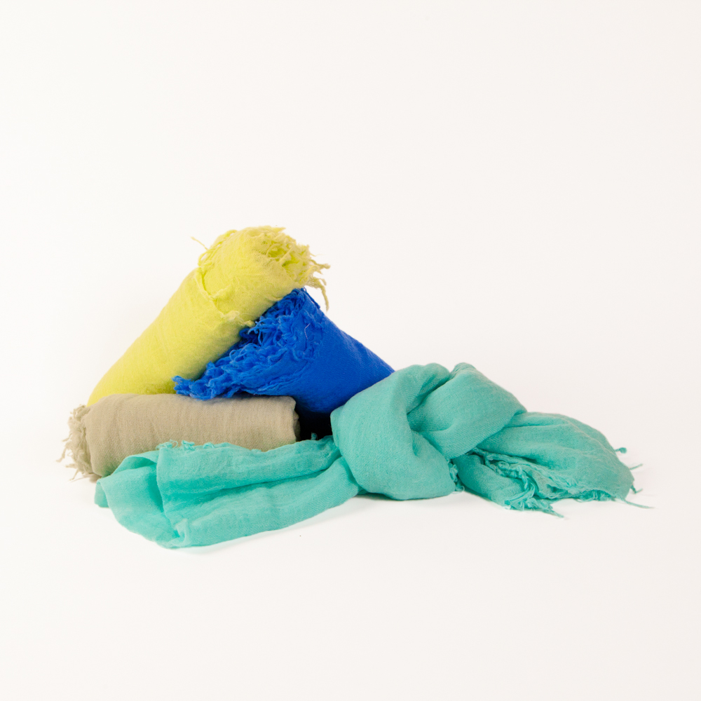 We adore these colorful, lightweight and warm cashmere scarves. Tip: never leave home without the cashmere.