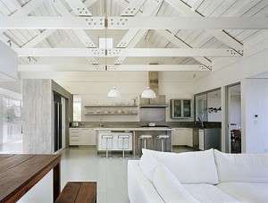 Wide open space and plenty of rustic trusses. We love this....and there's that white sofa again.