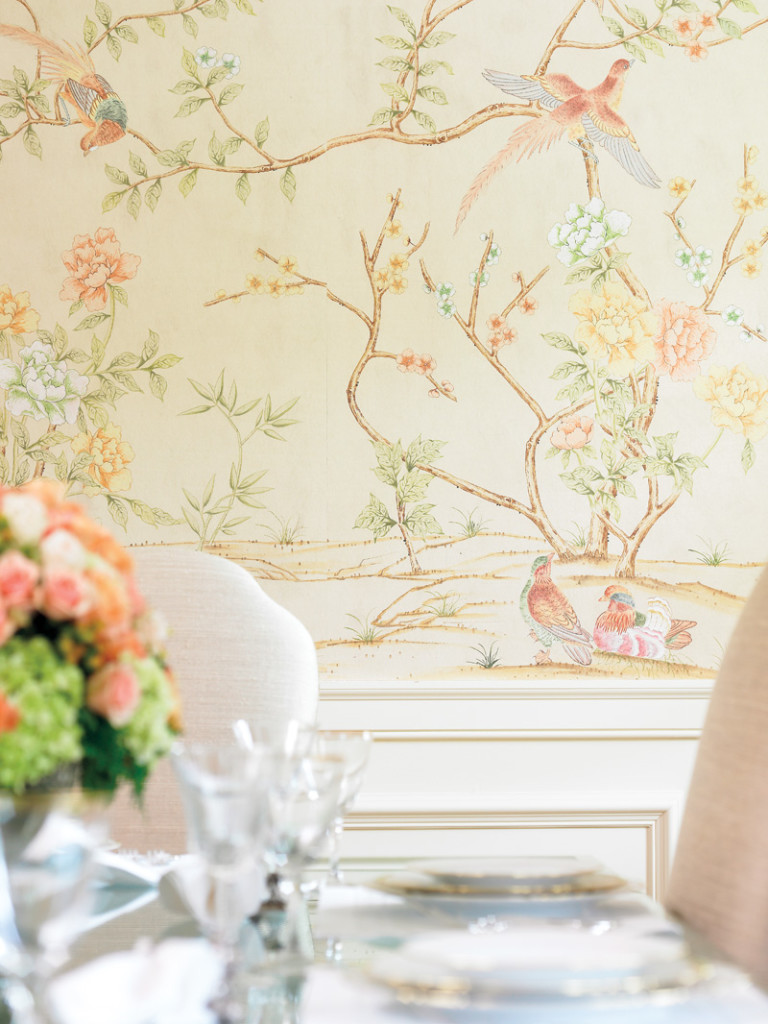 Delicate wallpaper makes a major statement in this dining room.