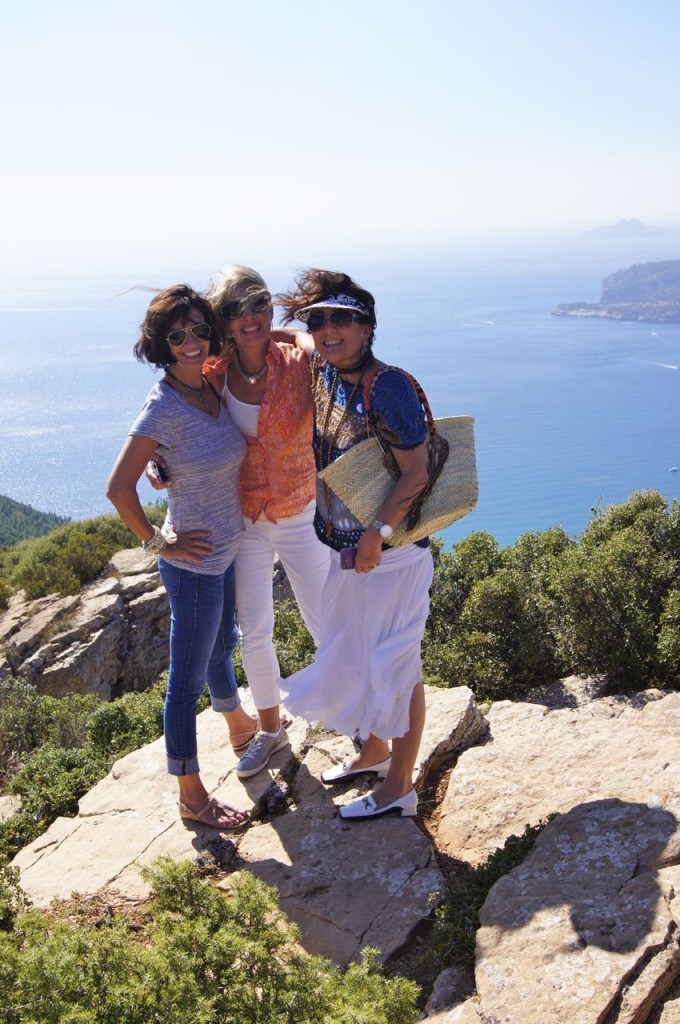 New and old friends pose with the Mediterranean as the backdrop.