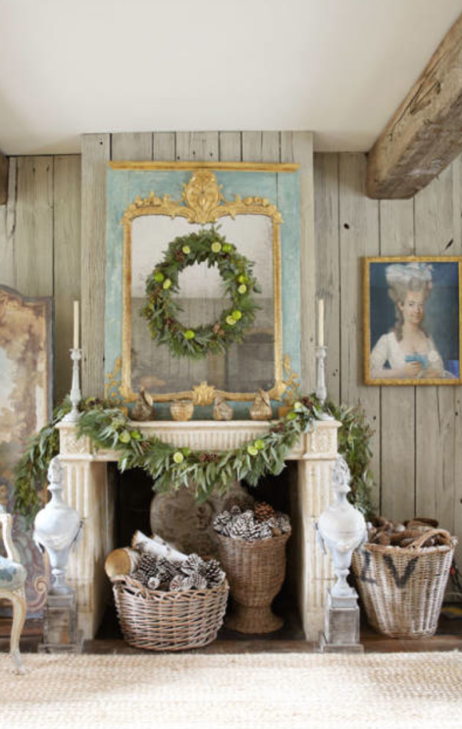 Ooooh la la. Loving a gorgeous blue trumeau, an antique portrait and a little swath of garland to holiday it up.