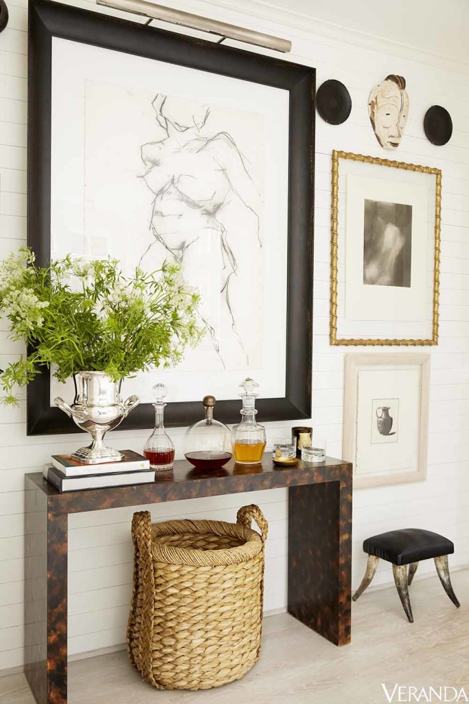 Collected art in Andrew Brown's hallway