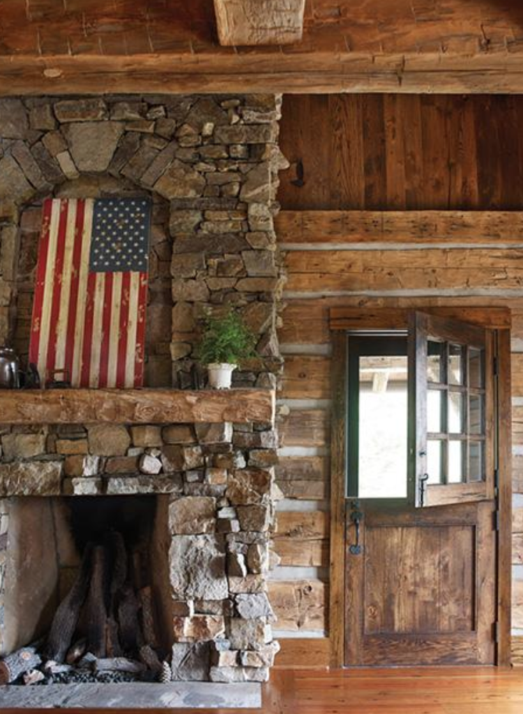 Nothing says rustic cabin better than a dutch door and Old Glory over the fireplace.