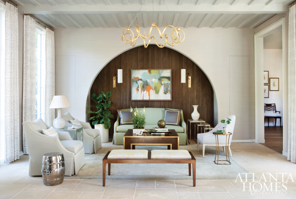 A view from the foyer into the living room. Clean, edgy, full of contrast and very livable. Painting by Andrea Costa at Huff Harrington Fine Art.