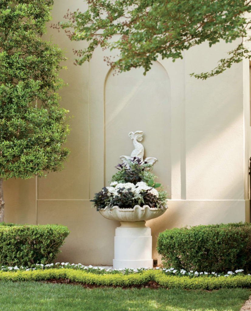 And I'm piqued by the idea of a little statue or elegant planter charmingly tucked somewhere, like Palmer Design Company did here. (Atlanta Homes and Lifestyles. Photo by Erica Dines.)
