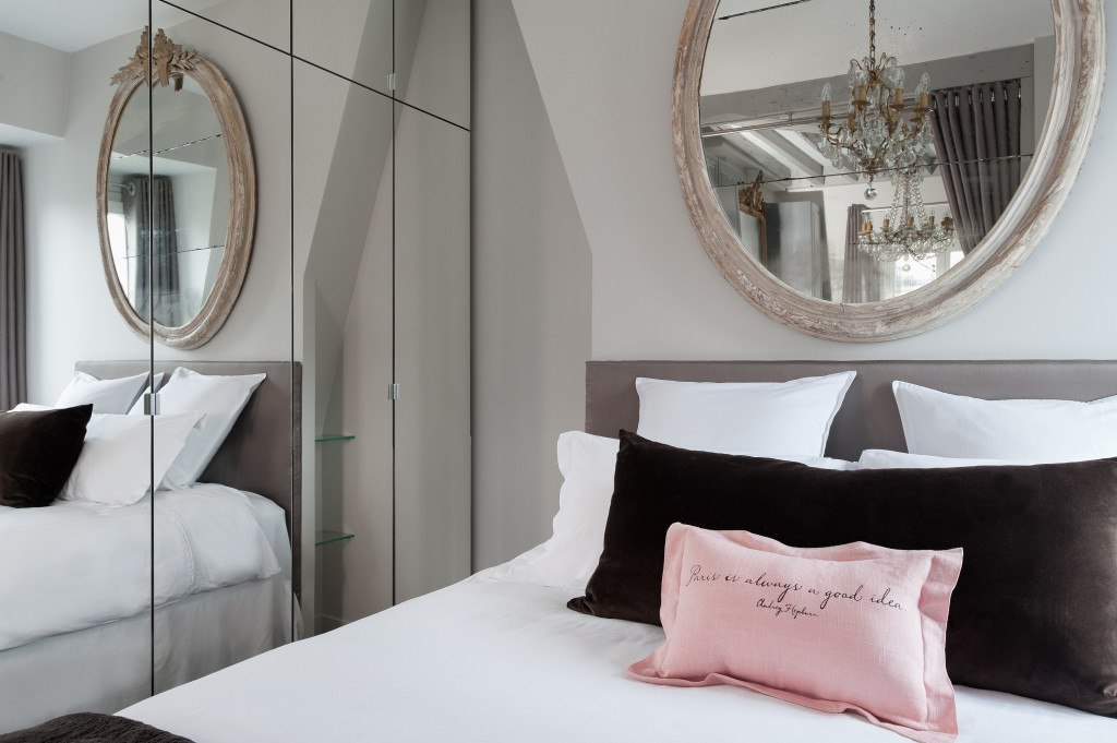 If you look closely, you'll see the reflections of two chandeliers in the mirror. It's a veritable Versailles!