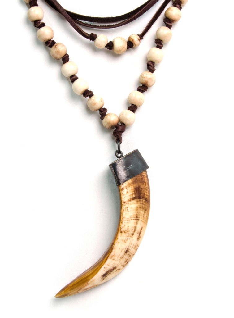 Cindy goes tribal with a wood bead and boar's tusk necklace.