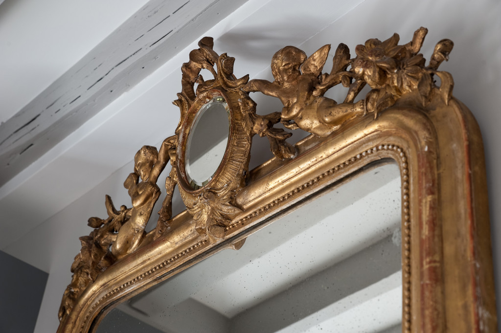 love is in the details, like the gilded cherubs of this 1850's Louis Philippe mirror.