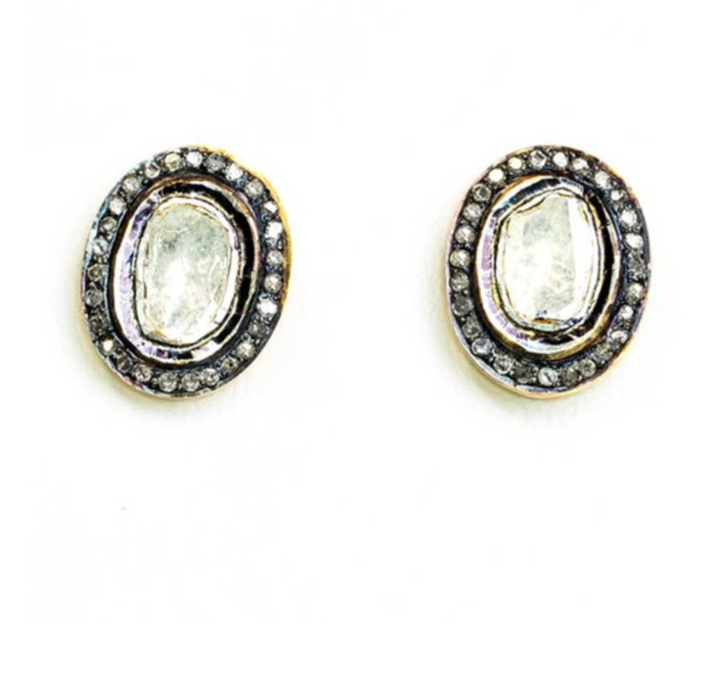 From Cindy Ensor Designs comes this gorgeous pair of studs featuring a rose-cut diamond oval center surrounded by pave diamonds. The front of the earring is darkened sterling silver. The back of the earring and the earring post are 14 karat gold.