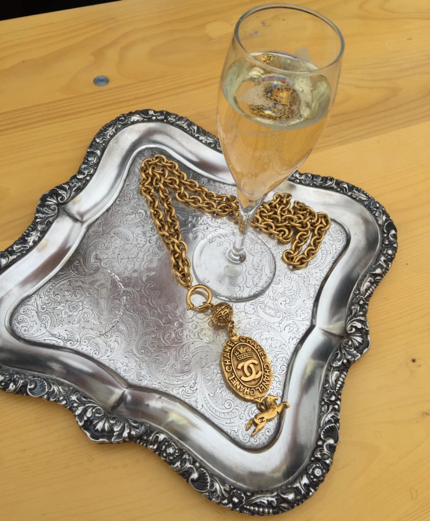 Chanel jewelry and champagne