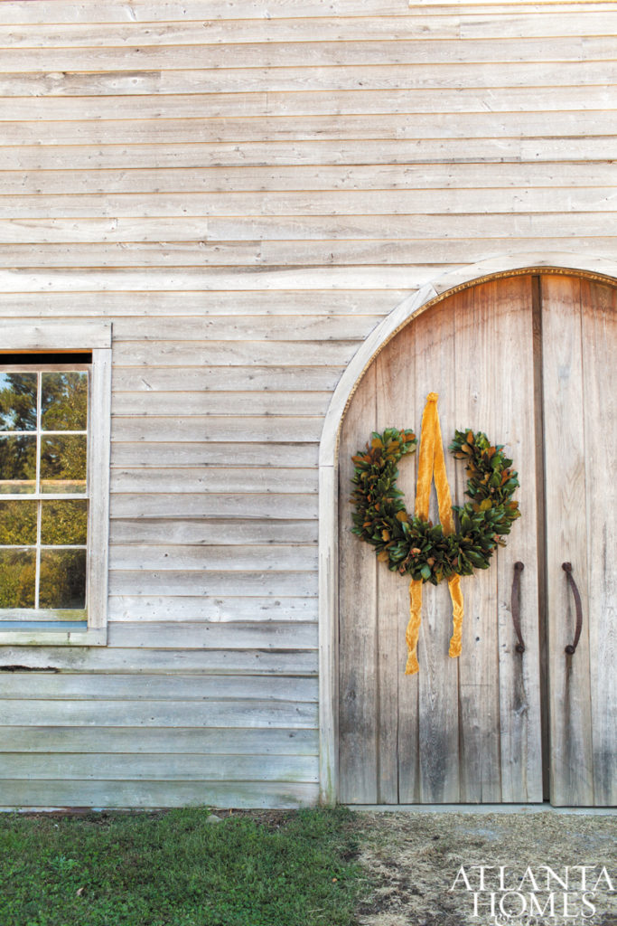 An unexpected pollen wreath and simple ribbon make a lovely statement. From Atlanta Homes & Lifestyles.