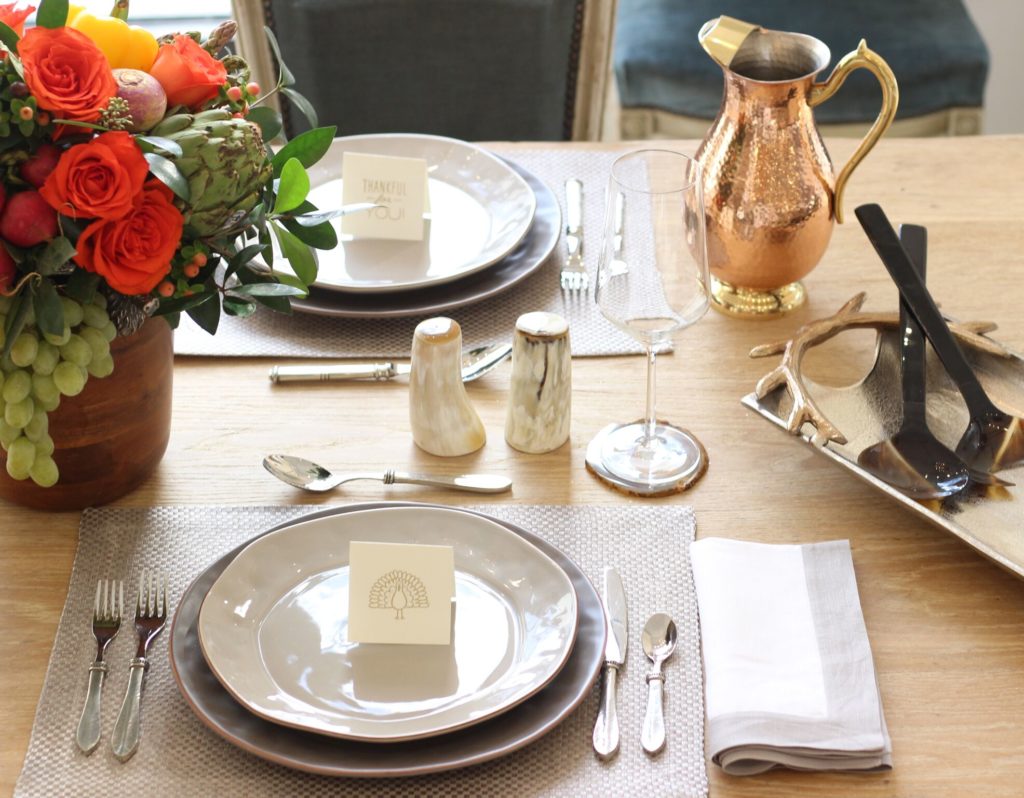 A darling turkey placecard, copper pitcher and antler serving piece tie it all together.