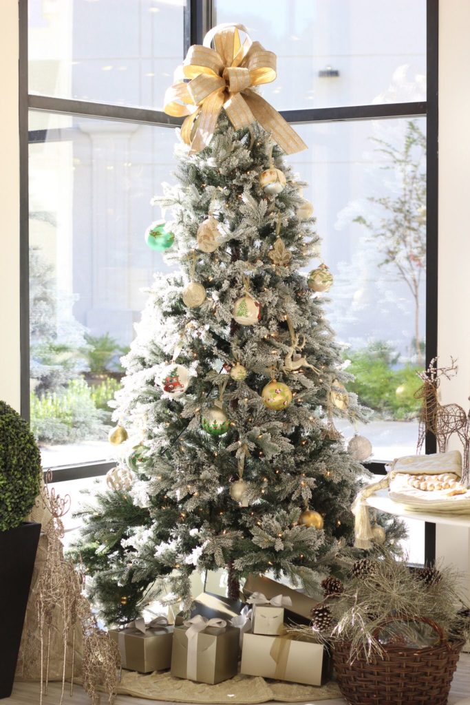 Our Huff Harrington Home tree, topped with one of Sam's signature bows.